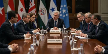 Diplomats discussing human rights issues at an international conference table.